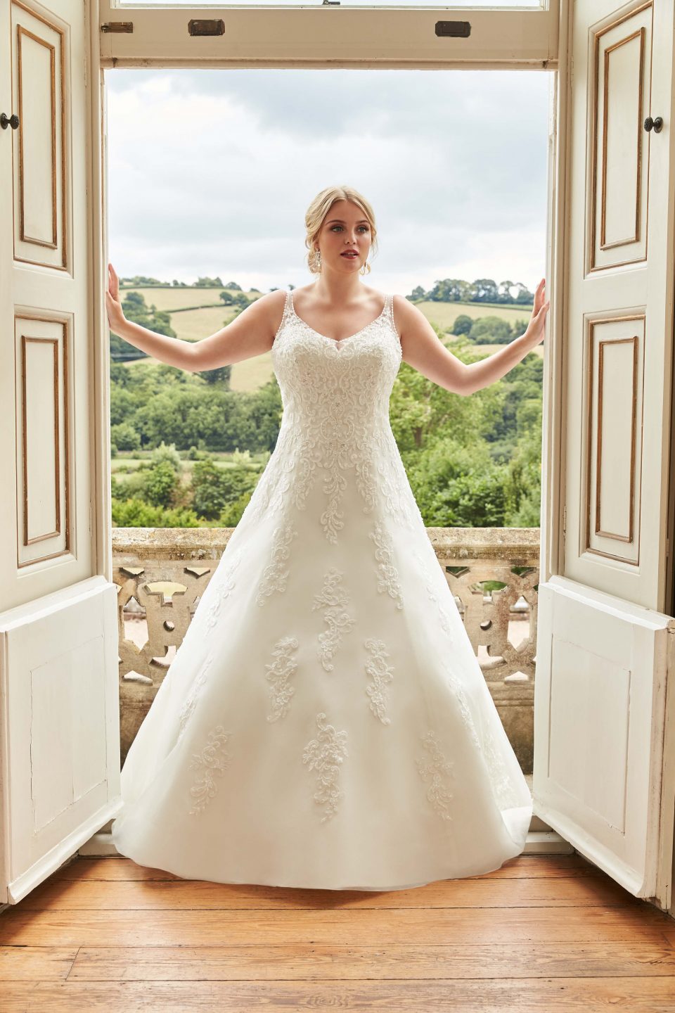 This is the perfect A-Line dress and a very flattering style for a plus size bride.
