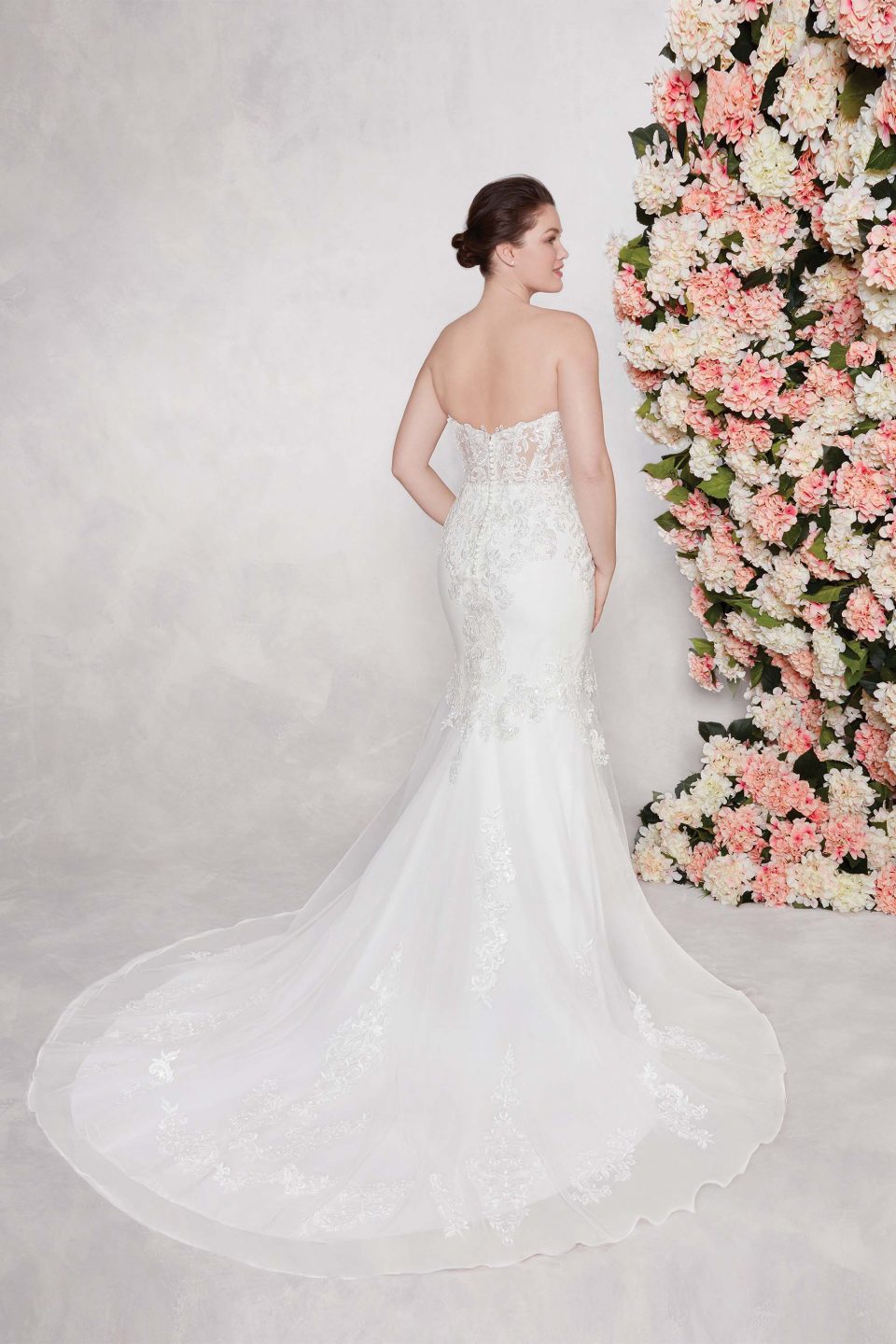 The soft mermaid tail of this dress is beautifully elegant.