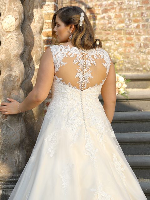 The lace appliqué, sheer back and yellow hue is stunning in this Ladybird dress.
