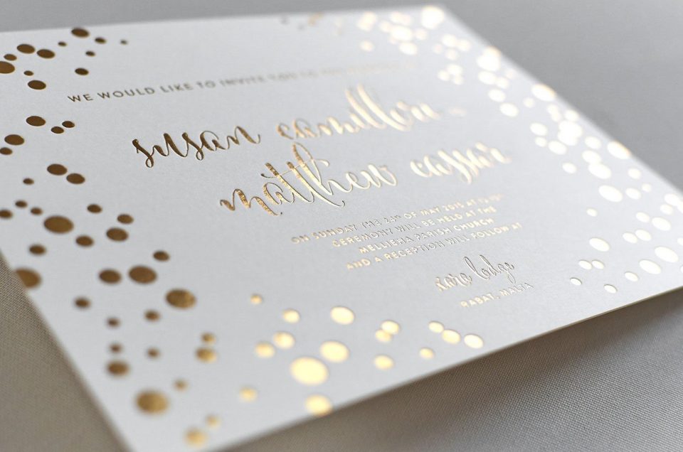 Gold embossed into wedding invitations