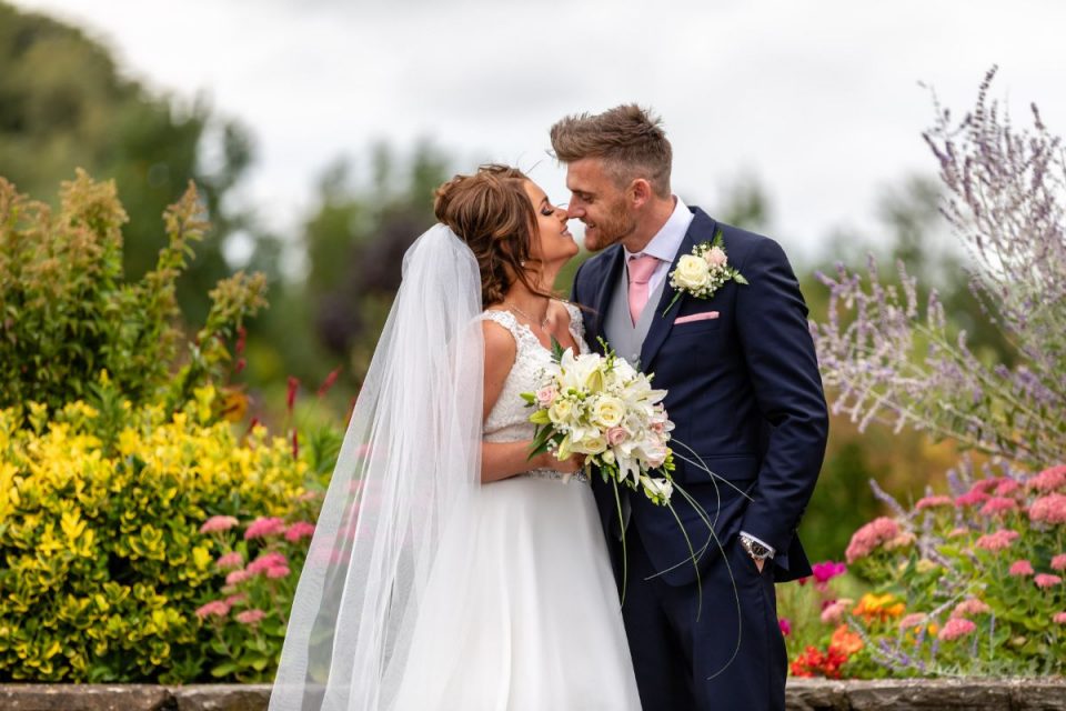 Emma and James on their wedding day in South Wales.