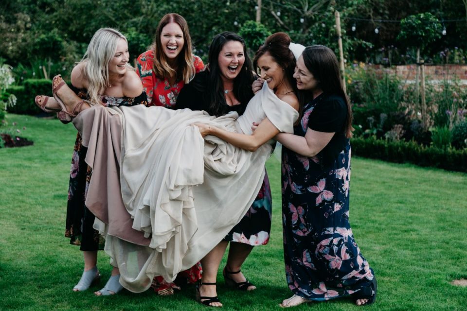 A great funny photo but it also shows off the bride's lovely dress!