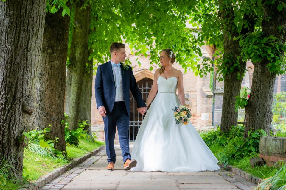 Another shot from Fay and Andy's special day as they walk away from the church they married in, hand in hand, Mr and Mrs.