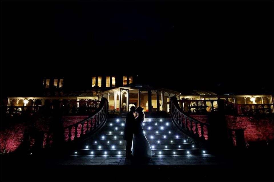 A couple lit up by the beautiful lights at Cricklade.