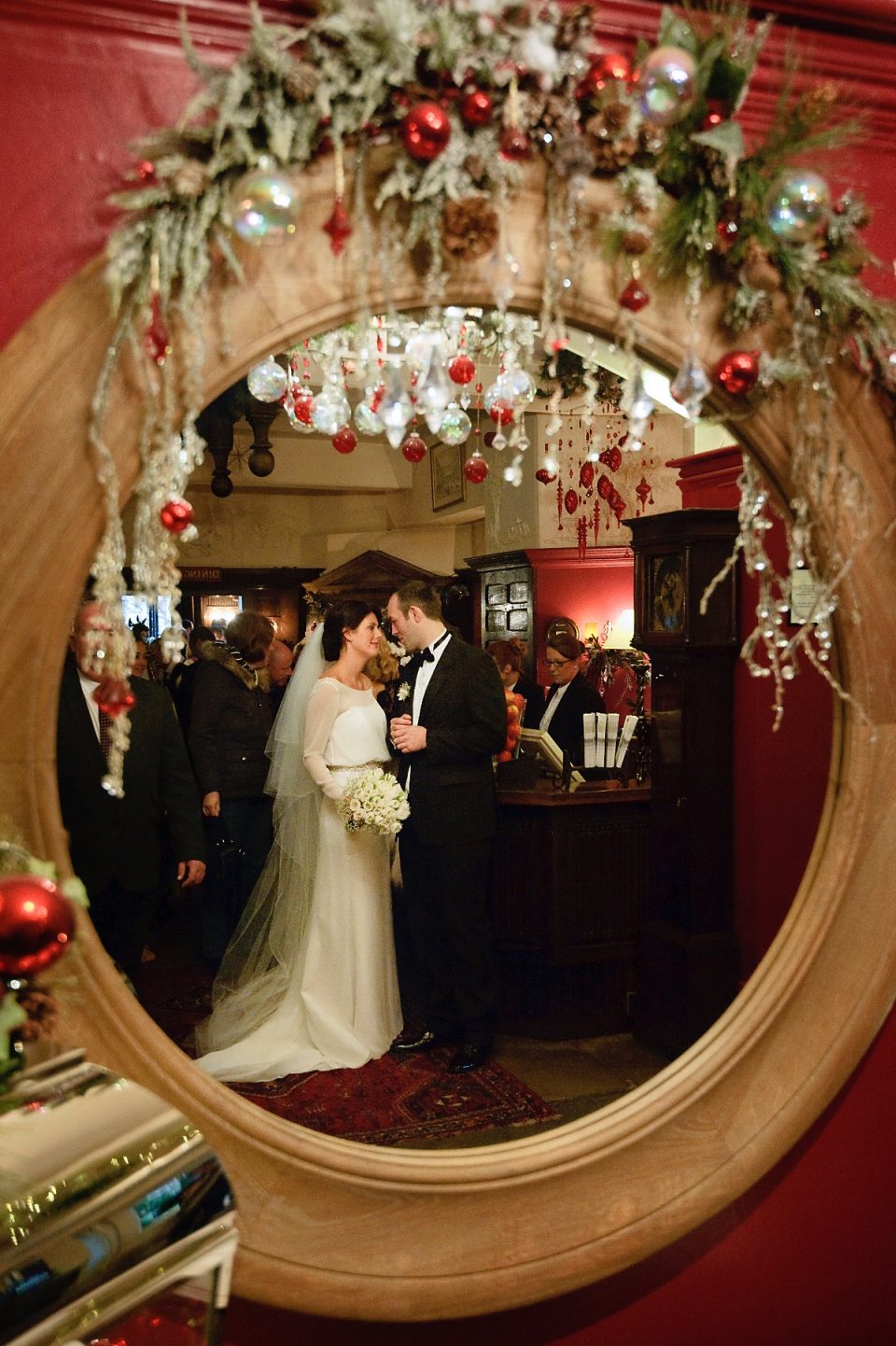 We love how their photographer - Scott Wood Photography - captured the couple in the reception to the George through a well decorated mirror! Feeling festive.
