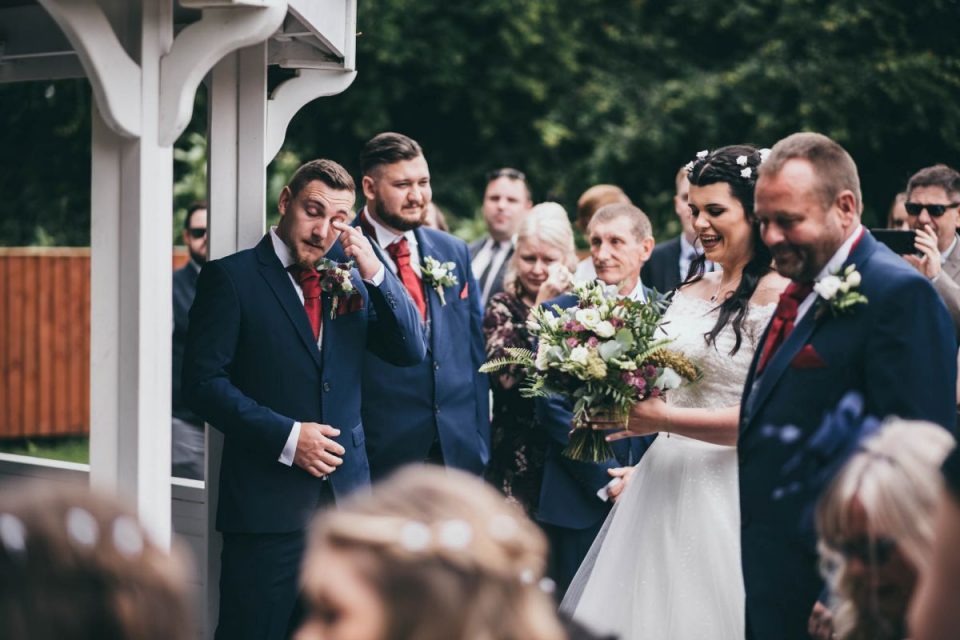 A shot of the groom sobbing as his bride walks down the aisle always feels moving, and OWO Photography have done a great job of capturing this one!