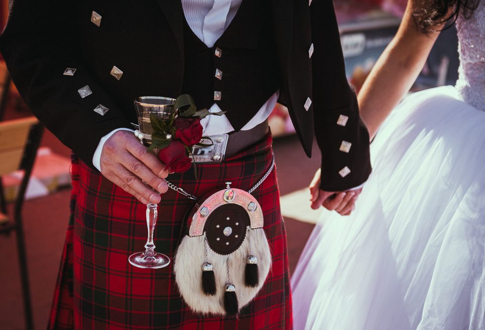 A kilt-sporting Scot with his wife!