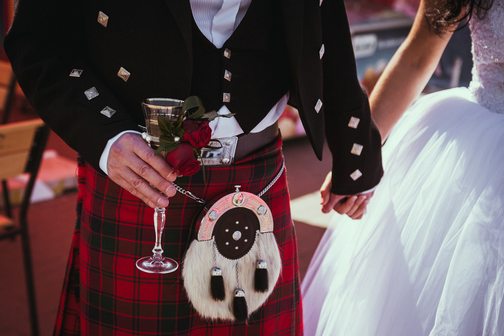 A kilt-sporting Scot with his wife!