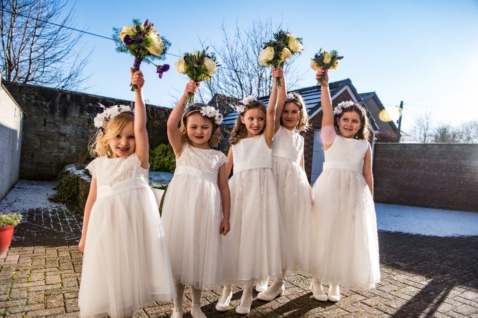 Hands in the air! The bridesmaid dresses are so cute.