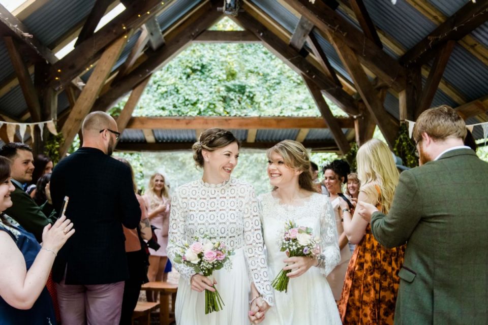 This beautiful couple walking back down the aisle as newlyweds!
