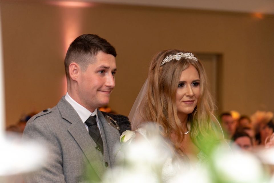Carley and Jamie exchanging vows.