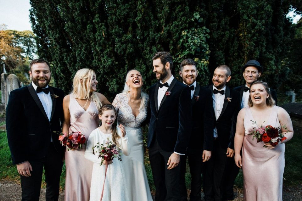 Such a sweet photo! We love the groommen's velvet tuxes too!