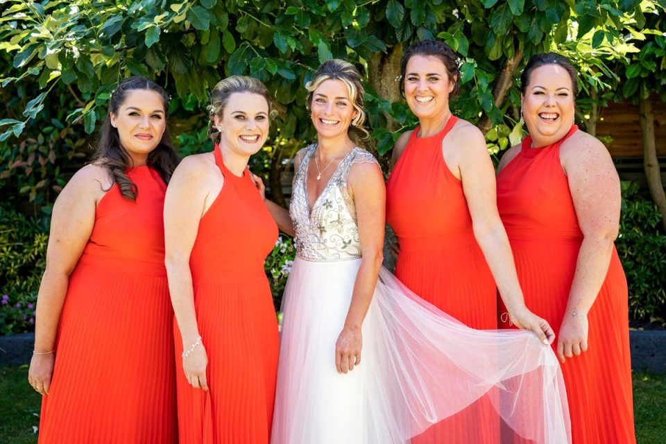 The beautiful bright colours of the bridesmaid dresses are perfect for such a sunny day!