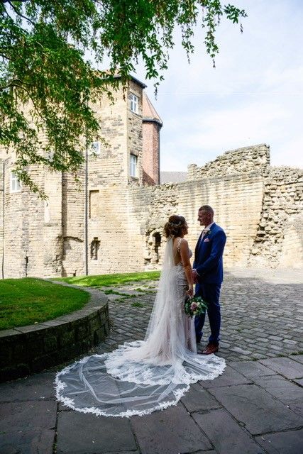 The couple standing outside Newcastle's Castle!