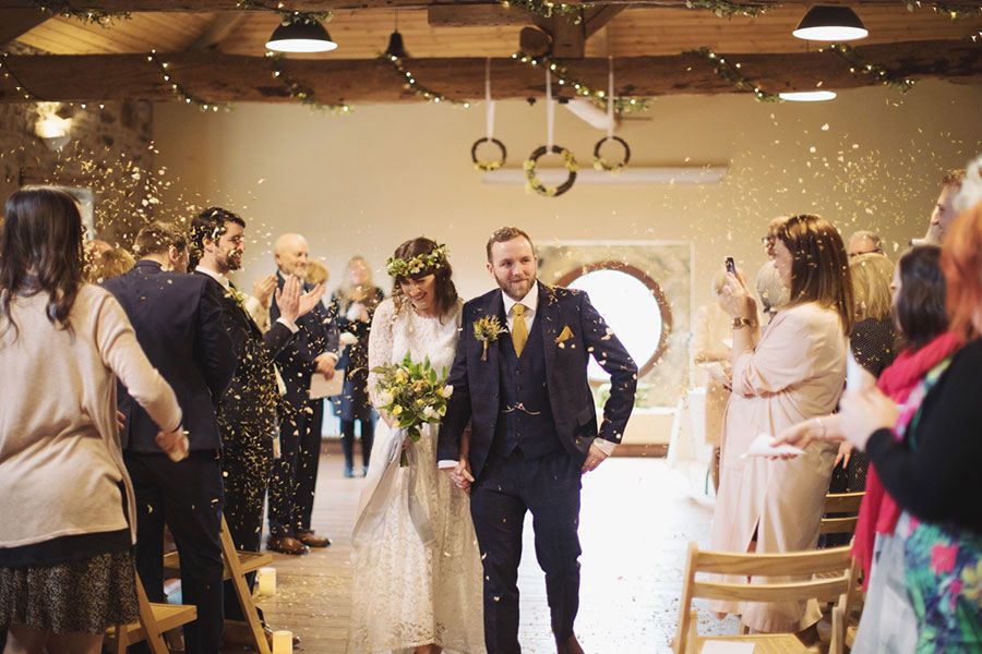 The happy couple walking back down the aisle!
