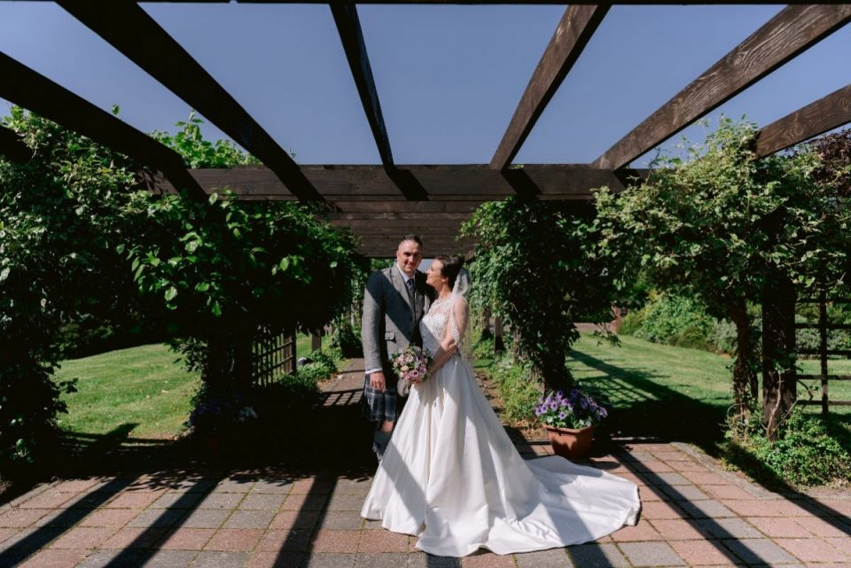 There's a pergola outside for ideal wedding photos.