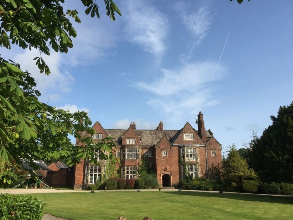 The beautiful Tudor mansion and its imposing façade.