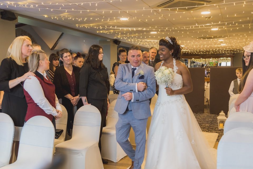Both brides were walked down the aisle.